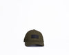 Green cap with black rub badge