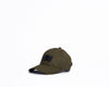 Green cap with black rub badge